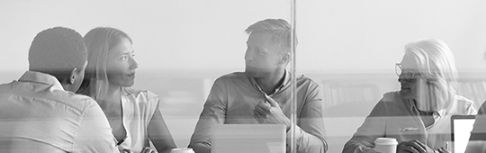 Business people negotiating at boardroom behind closed doors